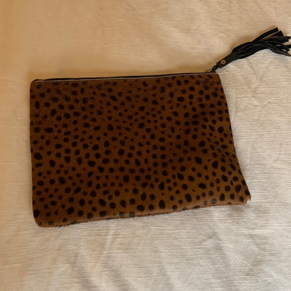 Gently used leopard pony hair clutch